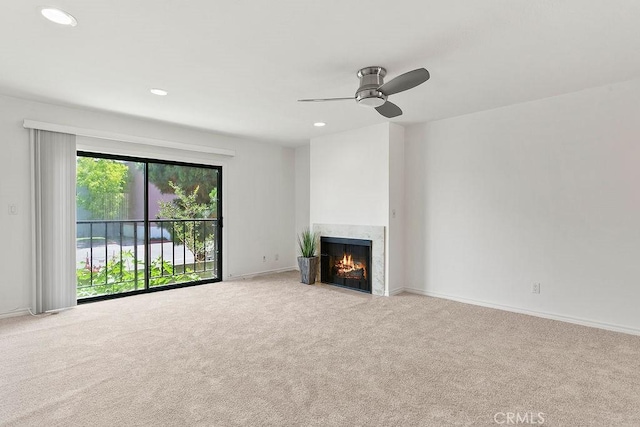 12400 Montecito Rd Unit 222, Seal Beach, CA 90740 - unfurnished living room with carpet flooring, ceiling fan, a fireplace, and recessed lighting