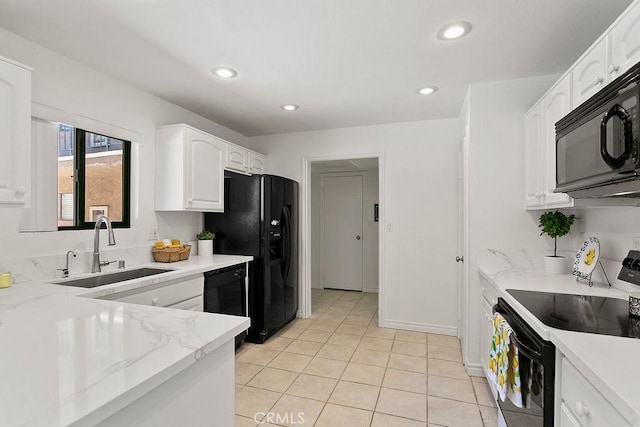 12400 Montecito Rd Unit 222, Seal Beach, CA 90740 - kitchen featuring black appliances, white cabinets, light tile patterned floors, light stone counters, and recessed lighting