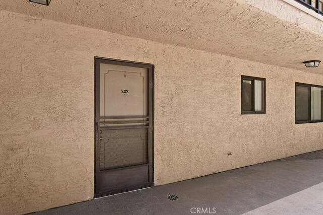 12400 Montecito Rd Unit 222, Seal Beach, CA 90740 - view of exterior entry with stucco siding