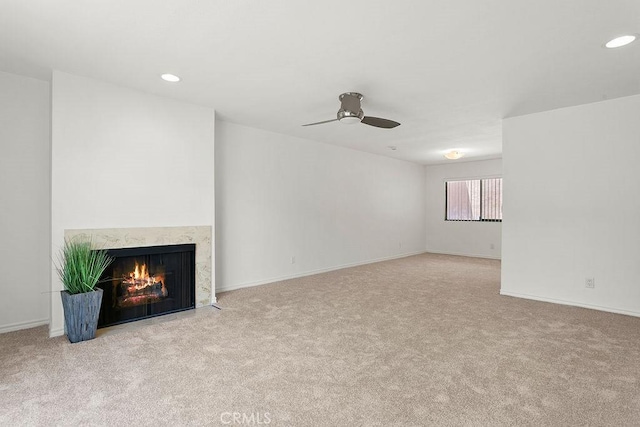 12400 Montecito Rd Unit 222, Seal Beach, CA 90740 - unfurnished living room with carpet floors, a high end fireplace, ceiling fan, and recessed lighting