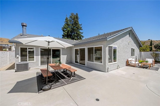 26017 Redbluff Dr, Calabasas, CA 91302 - back of house featuring stucco siding, a patio area, and an outdoor hangout area