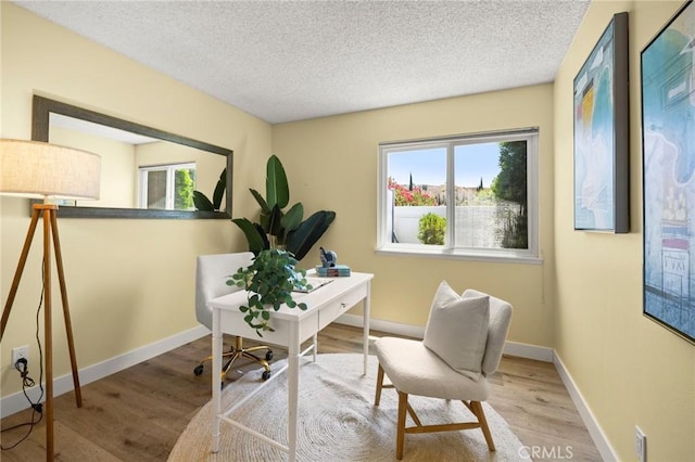26017 Redbluff Dr, Calabasas, CA 91302 - home office featuring wood finished floors and a textured ceiling