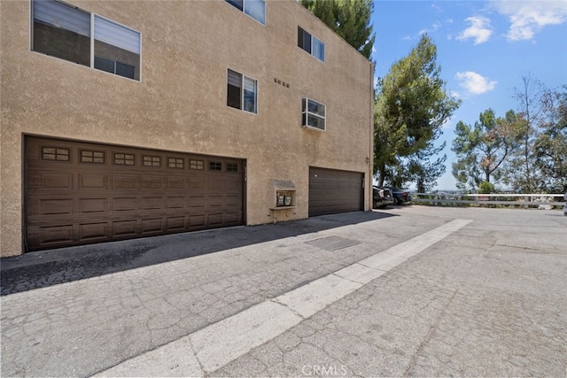 9778 Via Roma, Burbank, CA 91504 - view of home's exterior featuring stucco siding and an attached garage