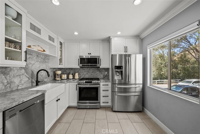 9778 Via Roma, Burbank, CA 91504 - kitchen with appliances with stainless steel finishes, backsplash, white cabinetry, and recessed lighting