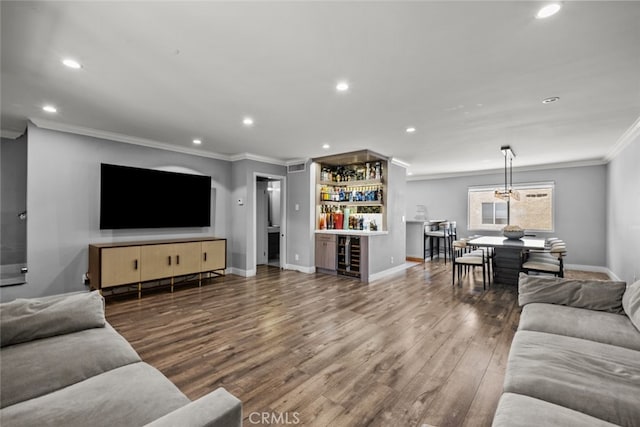 9778 Via Roma, Burbank, CA 91504 - living room with a bar, ornamental molding, beverage cooler, wood finished floors, and recessed lighting