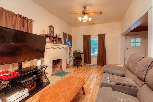 217 N Plumas St, Willows, CA 95988 - living room with ceiling fan, wood finished floors, and a fireplace