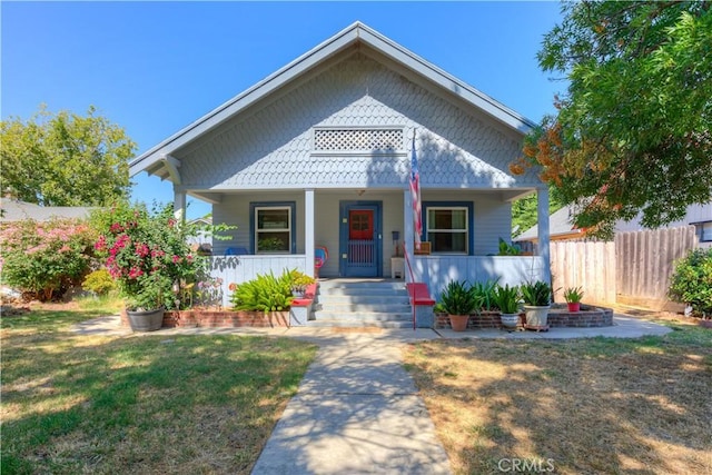 217 N Plumas St, Willows, CA 95988 - victorian-style house featuring a porch