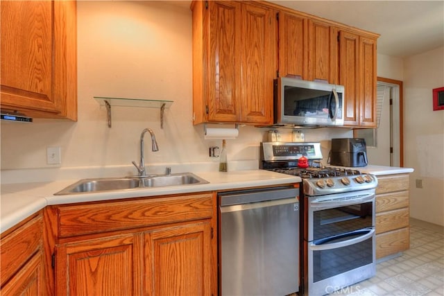 217 N Plumas St, Willows, CA 95988 - kitchen featuring stainless steel appliances, light countertops, brown cabinetry, and light floors