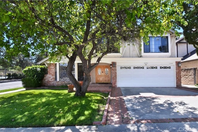17000 Addison St, Encino, CA 91316 - view of front of house featuring brick siding, driveway, a front lawn, and a garage