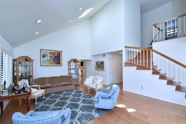 17000 Addison St, Encino, CA 91316 - living room with hardwood / wood-style floors, stairs, high vaulted ceiling, a skylight, and recessed lighting