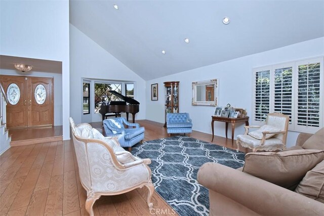 17000 Addison St, Encino, CA 91316 - living room with high vaulted ceiling, wood finished floors, and recessed lighting