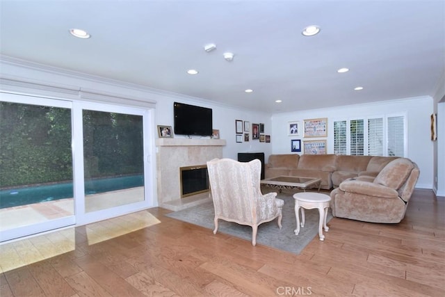 17000 Addison St, Encino, CA 91316 - living room with crown molding, wood finished floors, recessed lighting, a premium fireplace, and healthy amount of natural light