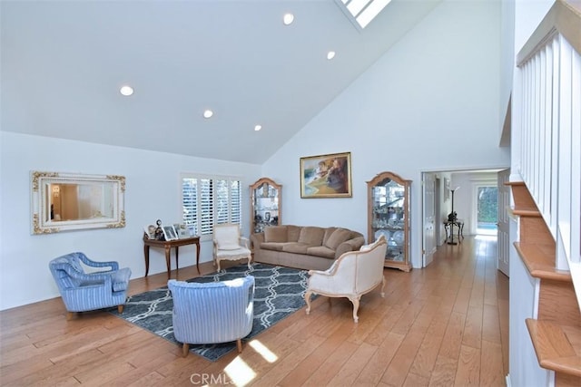 17000 Addison St, Encino, CA 91316 - living area featuring high vaulted ceiling, light wood-style floors, a skylight, and recessed lighting