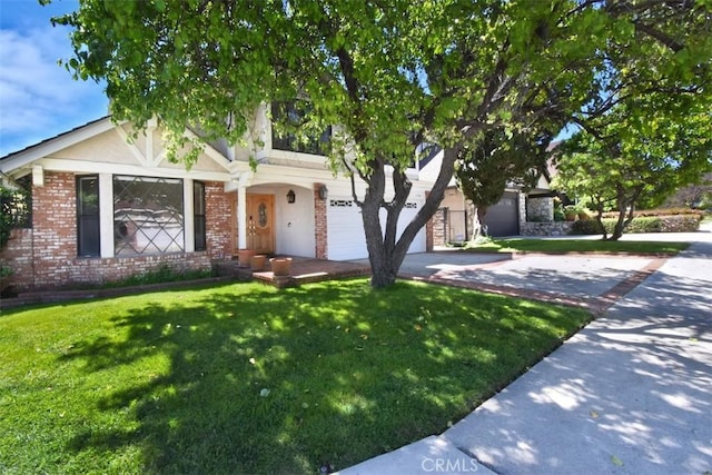 17000 Addison St, Encino, CA 91316 - view of front of home with concrete driveway, a front yard, brick siding, a garage, and stucco siding