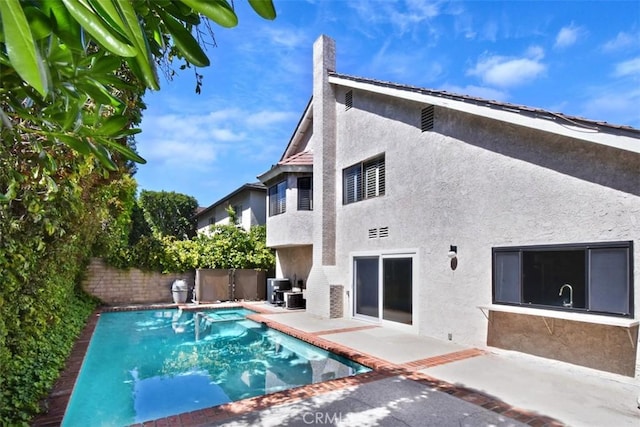 17000 Addison St, Encino, CA 91316 - back of property with stucco siding, a patio, and a fenced backyard