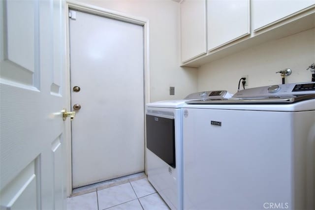17000 Addison St, Encino, CA 91316 - washroom with washing machine and dryer, cabinet space, and light tile patterned flooring