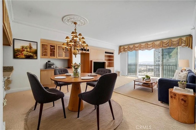 850 E Ocean Blvd Unit 1604, Long Beach, CA 90802 - dining room featuring a chandelier, light carpet, and ornamental molding