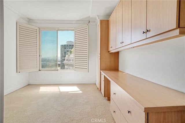 850 E Ocean Blvd Unit 1604, Long Beach, CA 90802 - interior space with light carpet, light countertops, built in desk, and crown molding