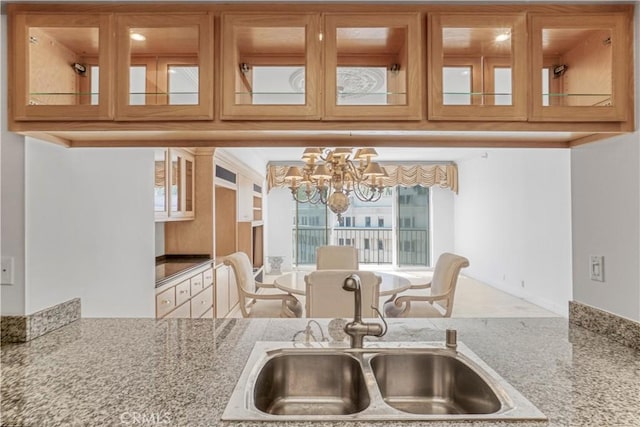 850 E Ocean Blvd Unit 1604, Long Beach, CA 90802 - kitchen featuring a chandelier and glass insert cabinets