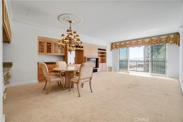 850 E Ocean Blvd Unit 1604, Long Beach, CA 90802 - dining area with a chandelier, light colored carpet, and crown molding