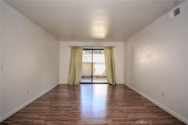1130 W Blaine St, Riverside, CA 92507 - spare room with dark wood-type flooring and baseboards