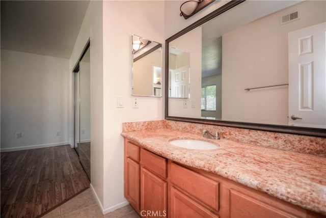 1130 W Blaine St, Riverside, CA 92507 - bathroom featuring vanity and wood finished floors