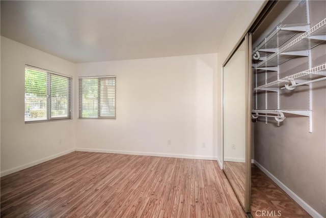 1130 W Blaine St, Riverside, CA 92507 - unfurnished bedroom with wood finished floors and a closet
