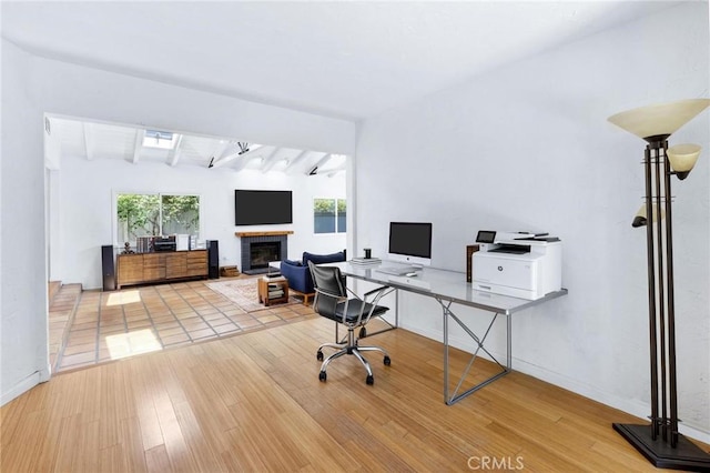 1544 3rd St, Manhattan Beach, CA 90266 - office featuring a fireplace with raised hearth, wood finished floors, and beamed ceiling