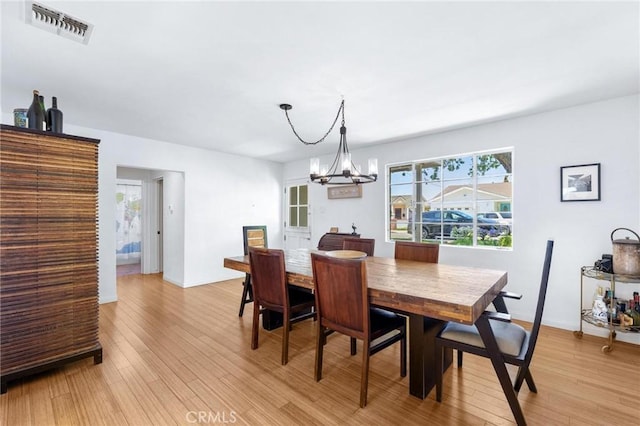 1544 3rd St, Manhattan Beach, CA 90266 - dining area with light wood-style flooring and a chandelier