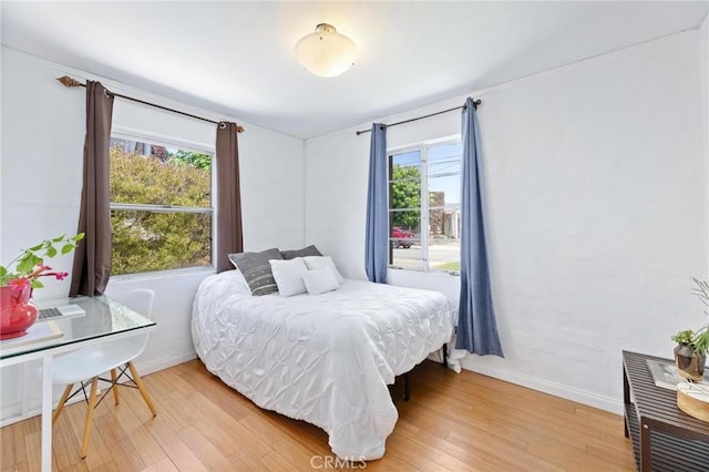 1544 3rd St, Manhattan Beach, CA 90266 - bedroom featuring light wood finished floors and multiple windows