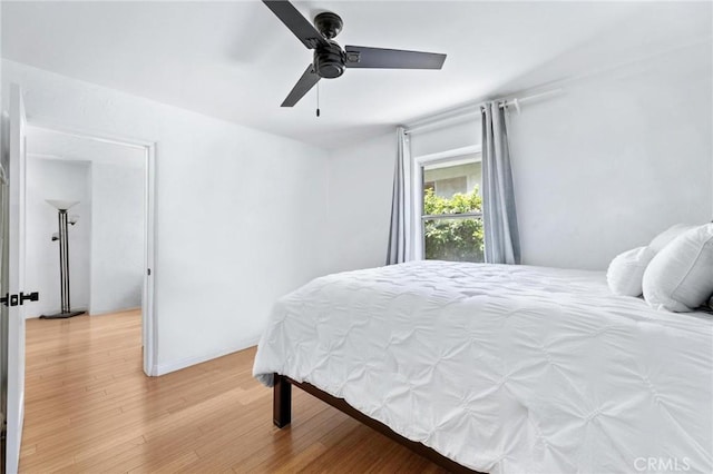 1544 3rd St, Manhattan Beach, CA 90266 - bedroom with light wood finished floors and a ceiling fan