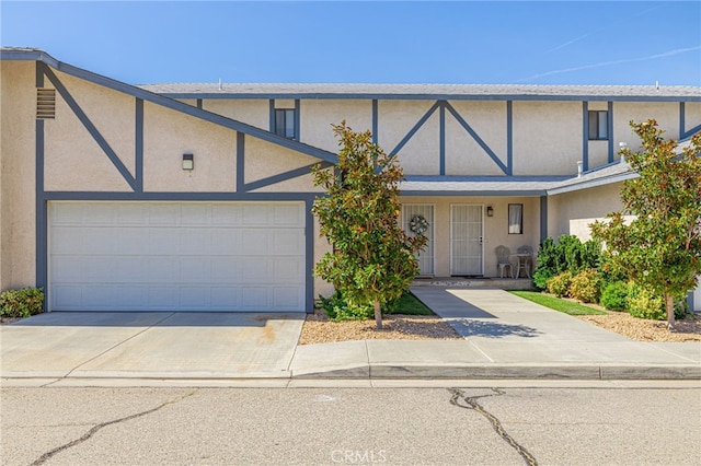 43840 Bobby Jones Dr Unit 22, Lancaster, CA 93536 - townhome / multi-family property with stucco siding and driveway