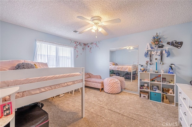 43840 Bobby Jones Dr Unit 22, Lancaster, CA 93536 - carpeted bedroom with a textured ceiling and a ceiling fan