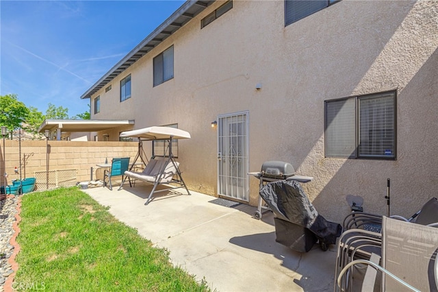 43840 Bobby Jones Dr Unit 22, Lancaster, CA 93536 - back of property with a patio area and stucco siding