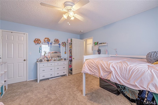 43840 Bobby Jones Dr Unit 22, Lancaster, CA 93536 - bedroom featuring light carpet, a textured ceiling, and ceiling fan