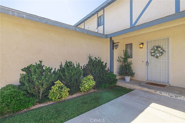 43840 Bobby Jones Dr Unit 22, Lancaster, CA 93536 - view of exterior entry with stucco siding