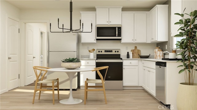 14811 Indigo Rd, Apple Valley, CA 92307 - kitchen featuring appliances with stainless steel finishes, a chandelier, light wood finished floors, white cabinetry, and light countertops