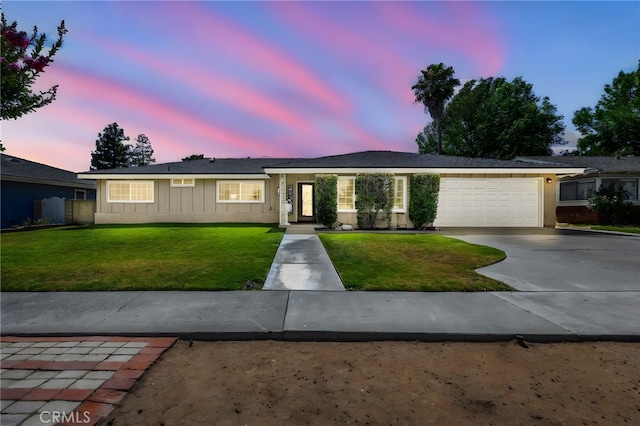 1219 N Van Buren St, Placentia, CA 92870 - ranch-style house featuring a front yard, an attached garage, driveway, and board and batten siding