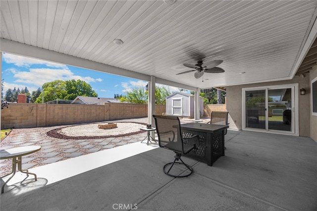 1219 N Van Buren St, Placentia, CA 92870 - fenced backyard with a shed, a patio, a fire pit, and outdoor dining area