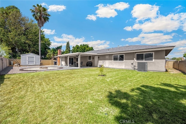 1219 N Van Buren St, Placentia, CA 92870 - rear view of property with a storage unit, a fenced backyard, stucco siding, and a patio area