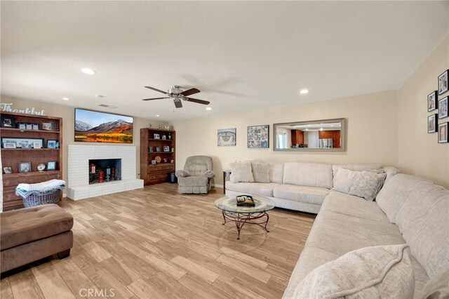 1219 N Van Buren St, Placentia, CA 92870 - living room featuring a ceiling fan, recessed lighting, light wood-style flooring, and a fireplace