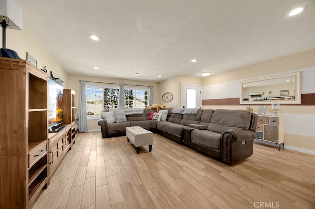 1219 N Van Buren St, Placentia, CA 92870 - living room with light wood finished floors, recessed lighting, and a textured ceiling