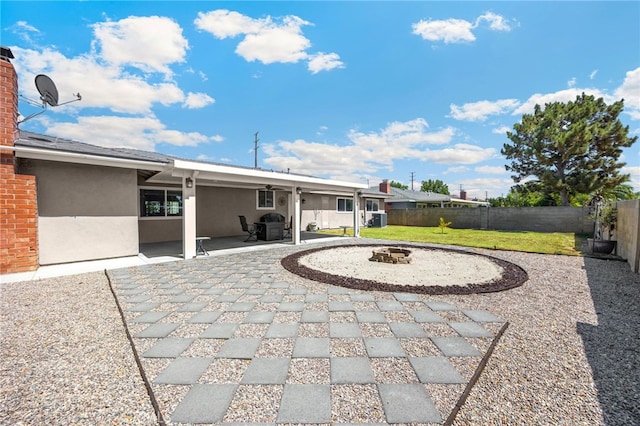 1219 N Van Buren St, Placentia, CA 92870 - fenced backyard with an outdoor fire pit and a patio
