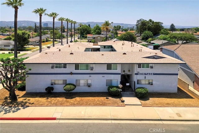 270 E Badillo St, Covina, CA 91723 - view of front of property with a residential view, stucco siding, and a mountain view