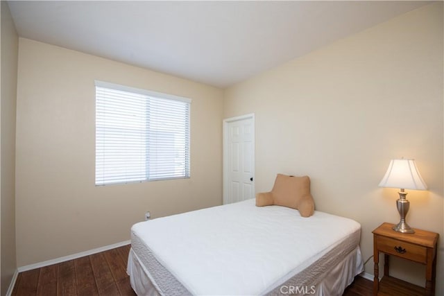 8718 Snowmass Peak Way, Riverside, CA 92508 - bedroom featuring dark wood-type flooring and baseboards
