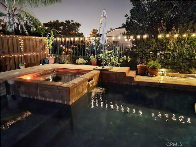 8718 Snowmass Peak Way, Riverside, CA 92508 - view of swimming pool with an in-ground hot tub, a fenced backyard, and a pool