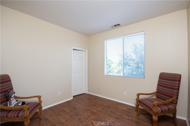 8718 Snowmass Peak Way, Riverside, CA 92508 - living area with dark wood-style flooring and baseboards