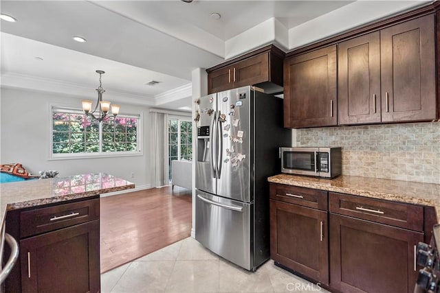 1128 Huntington Dr Unit C, South Pasadena, CA 91030 - kitchen with stainless steel appliances, decorative backsplash, dark brown cabinets, a chandelier, and ornamental molding