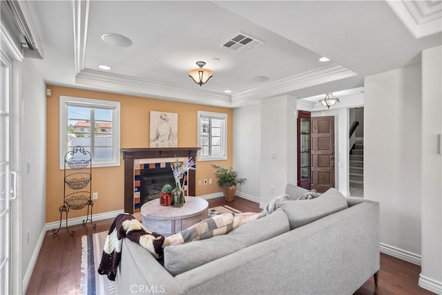 1128 Huntington Dr Unit C, South Pasadena, CA 91030 - living room with a tray ceiling, a tile fireplace, stairway, ornamental molding, and dark wood-type flooring
