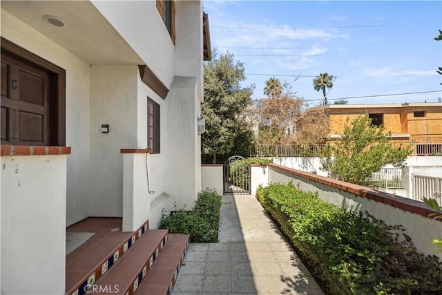 1128 Huntington Dr Unit C, South Pasadena, CA 91030 - view of home's exterior with stucco siding and a gate
